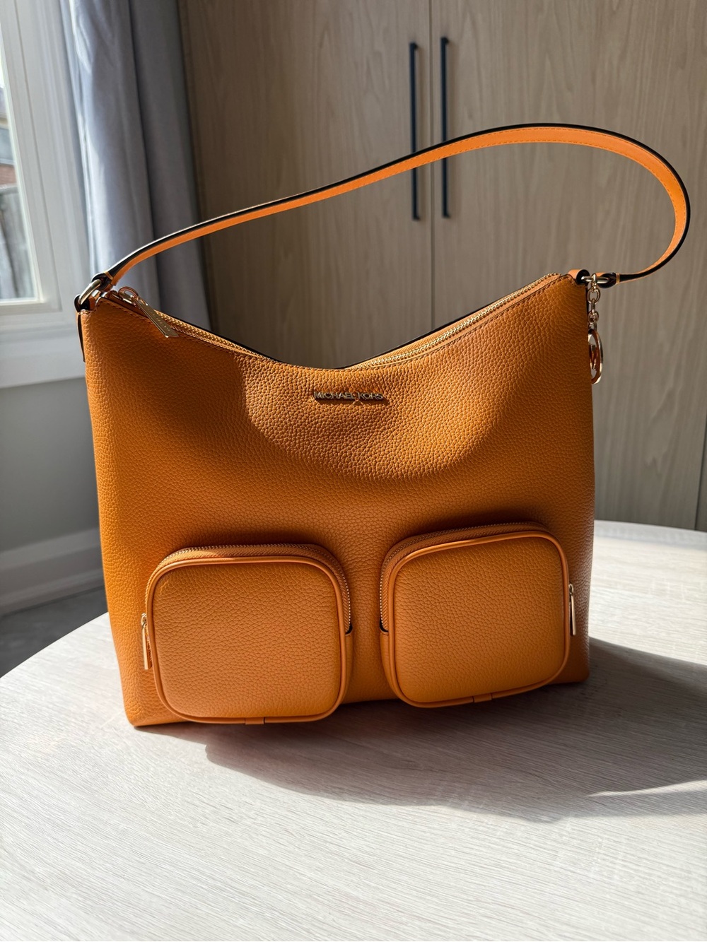 Michael Kors Orange Pebbled Leather Merritt bag